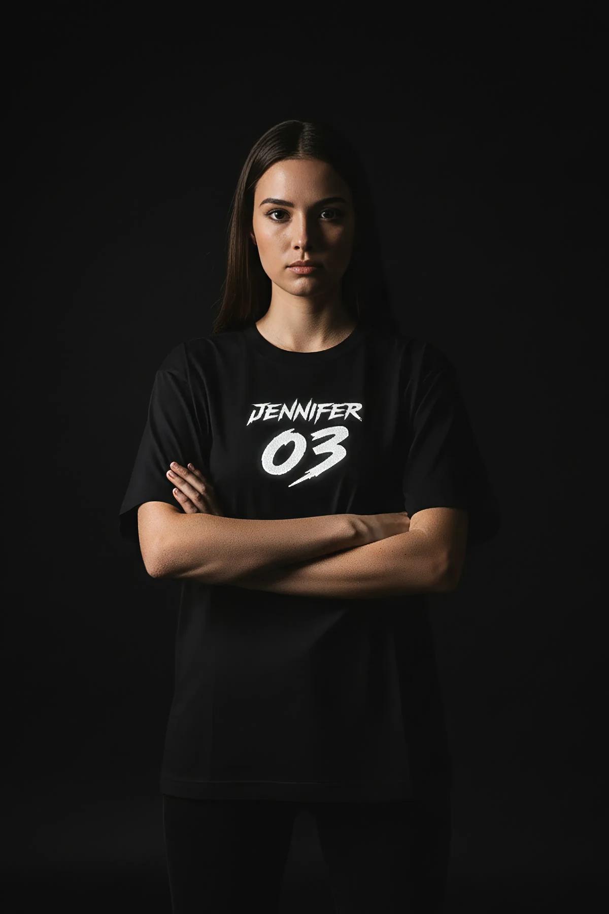 oversized black reflective tee with large block number centered below personalized name graphic