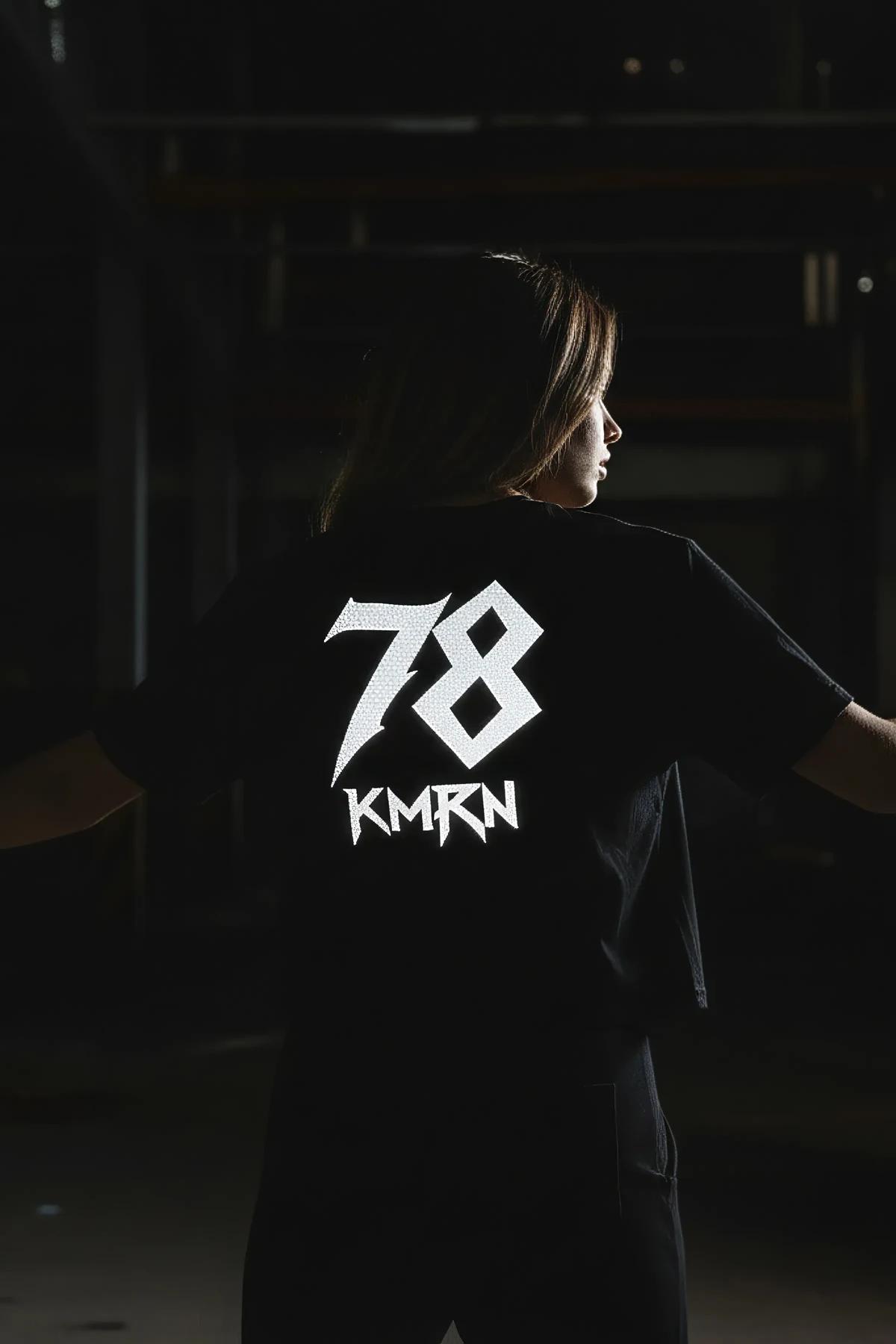 custom graphic t-shirt back print detail showing gothic bold font name and number layout in white on black