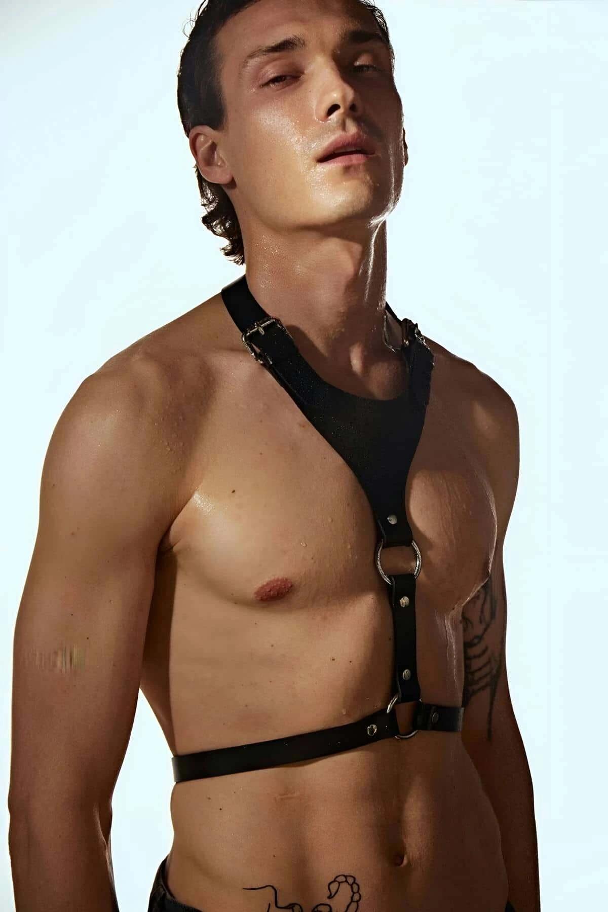 Side angle of black PU strap chest harness showing shoulder buckle adjustment detail