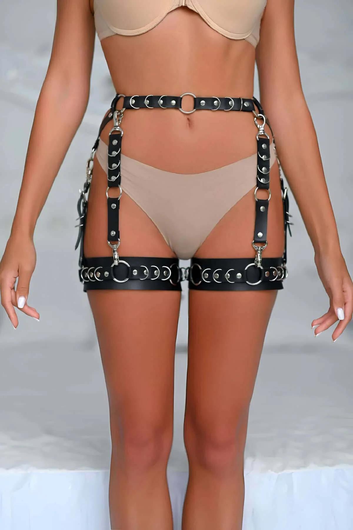 Front view of black faux leather waist band with center silver O-ring and prong buckle closure