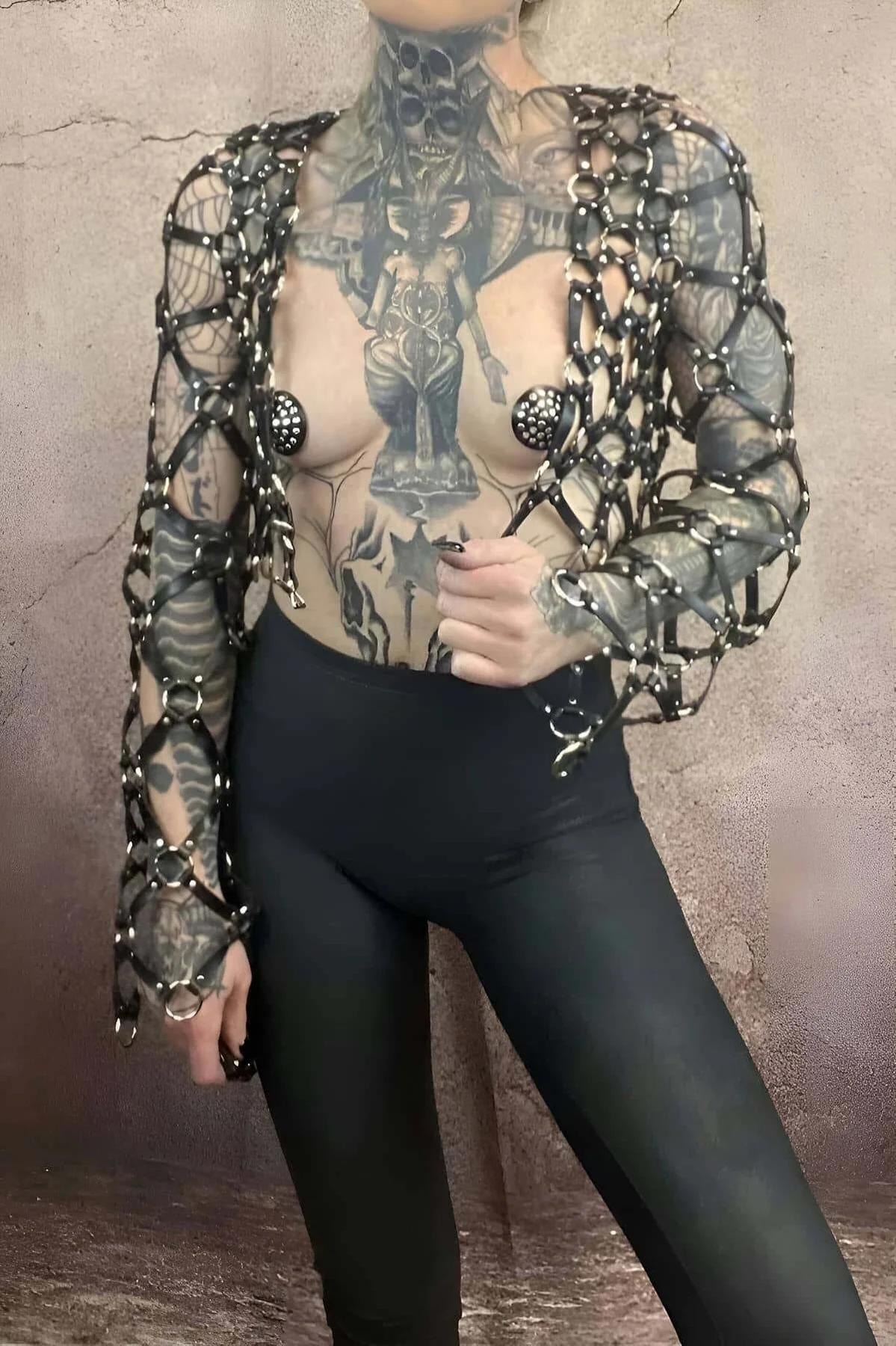 close-up of black PU leather lattice straps and silver rivet O-rings on cage body harness