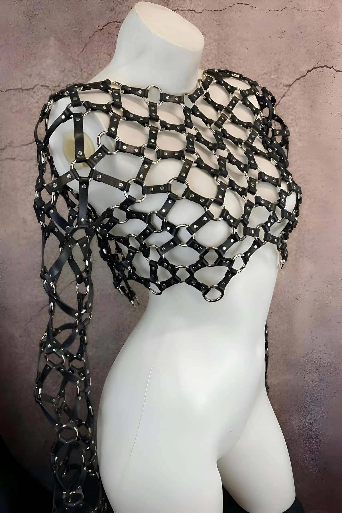 wrist detail of black faux leather sleeve harness with adjustable silver O-ring closure