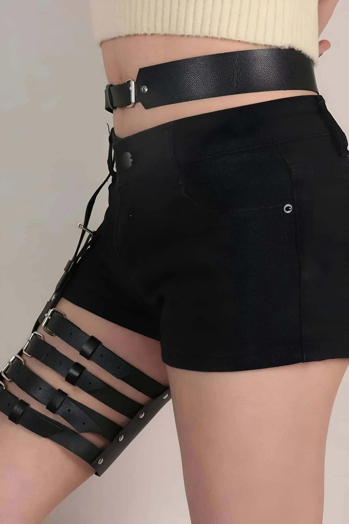 Side view of adjustable black garter harness showing leg strap length and thigh band position