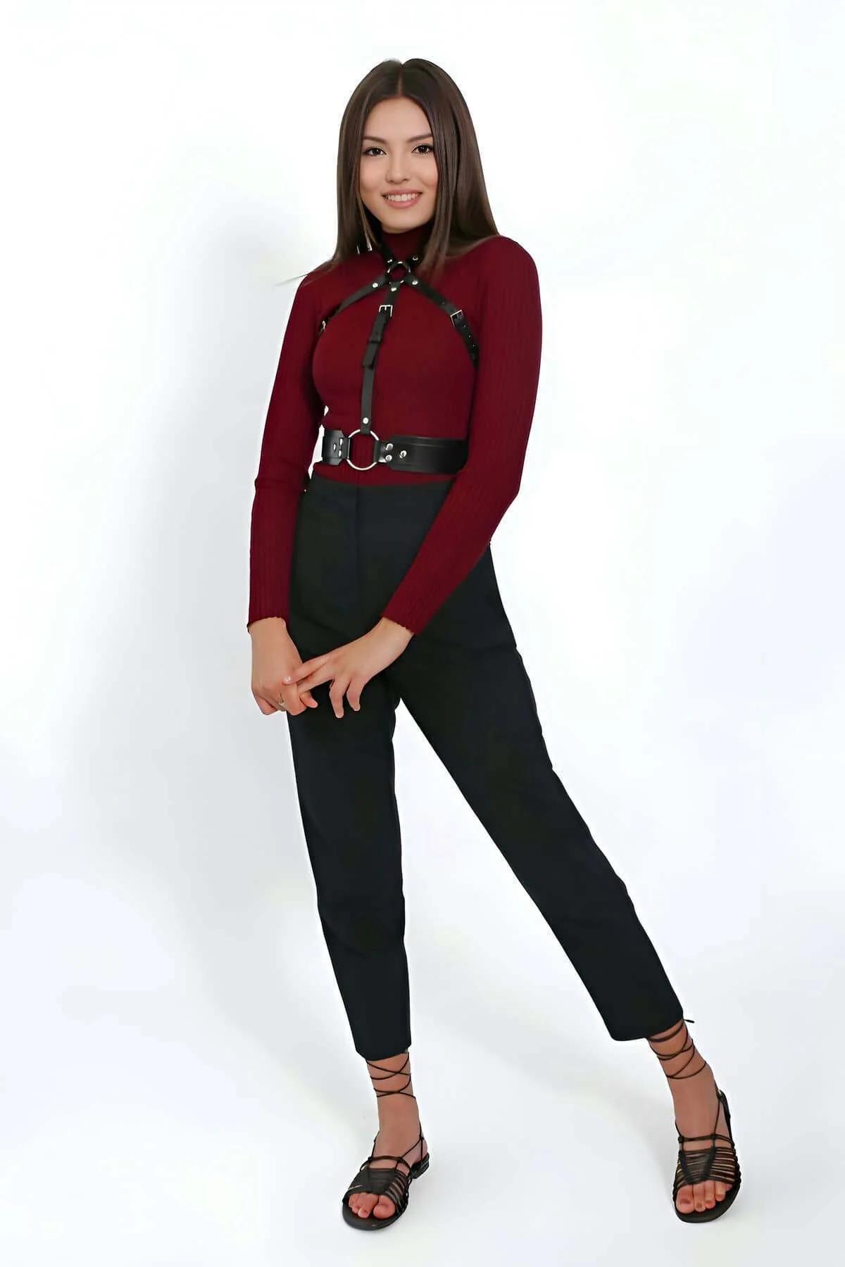 Silver-tone chest buckle and slim neck collar strap detail on black faux leather body harness
