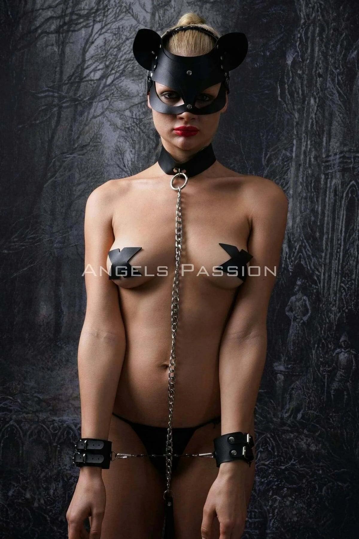 Full five-piece black cat harness set laid out showing mask collar chain cuffs and waist piece