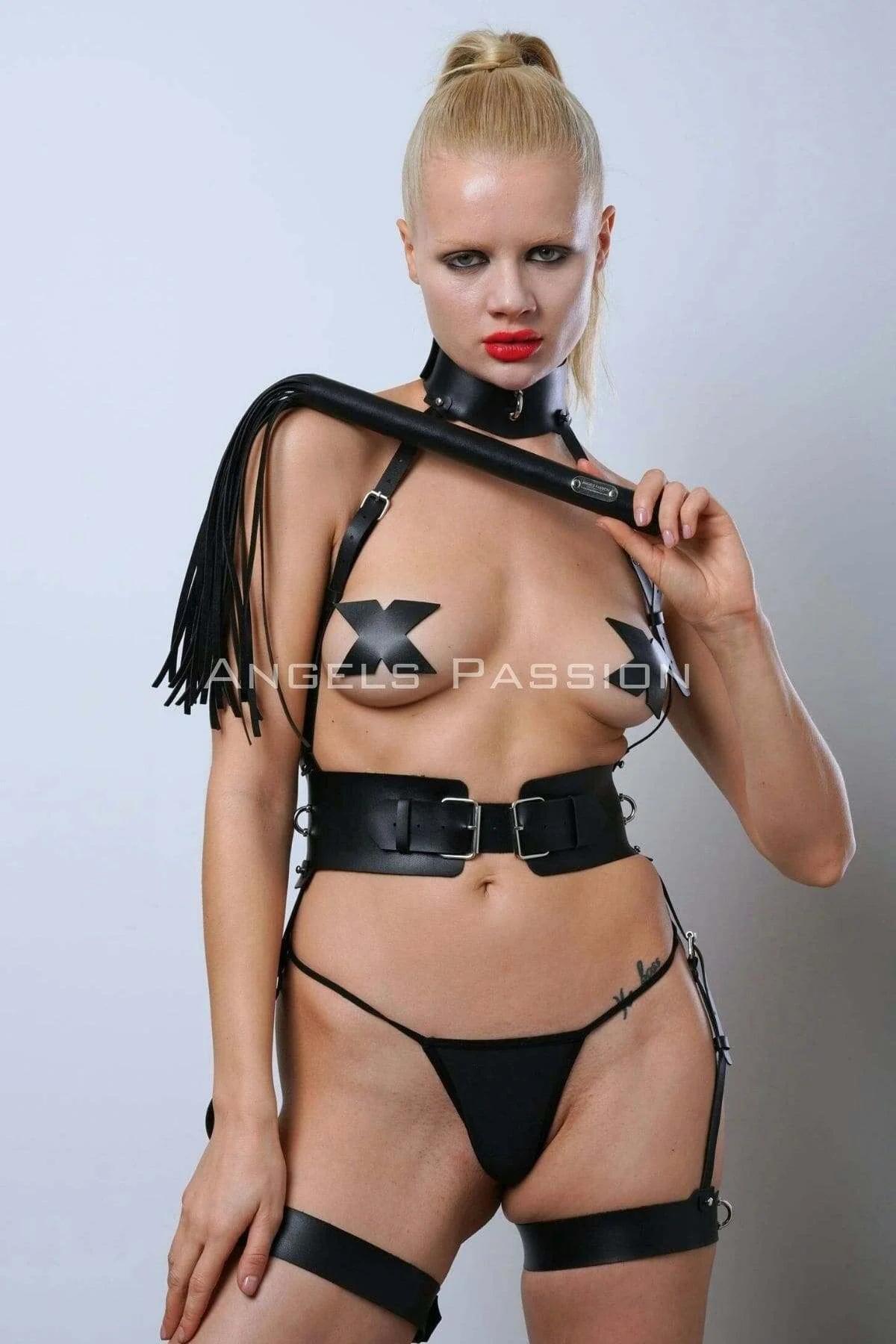Front view of black PU faux leather full body harness showing double-buckle wide waist belt and silver O-ring connectors