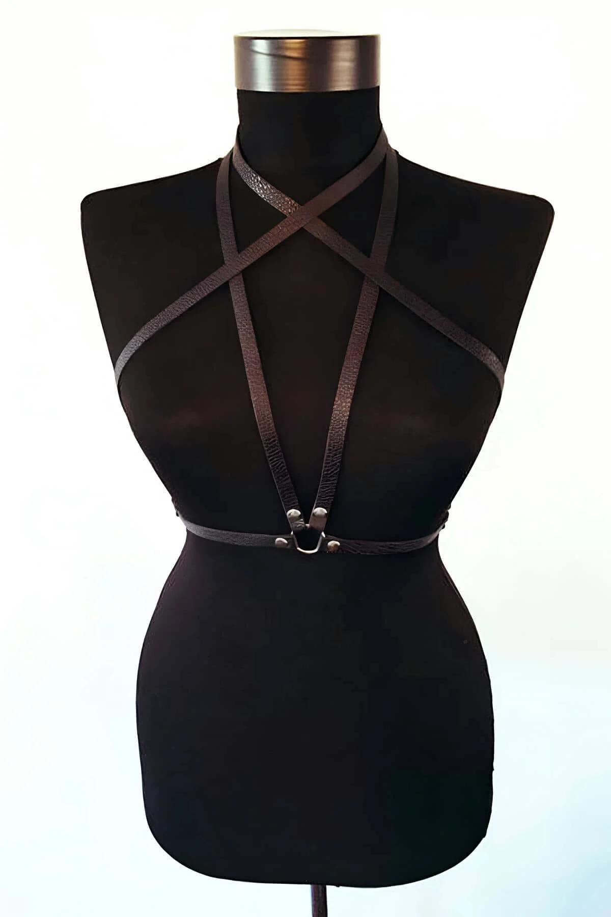 black pebble-grain faux leather chest harness criss-cross strap detail close-up