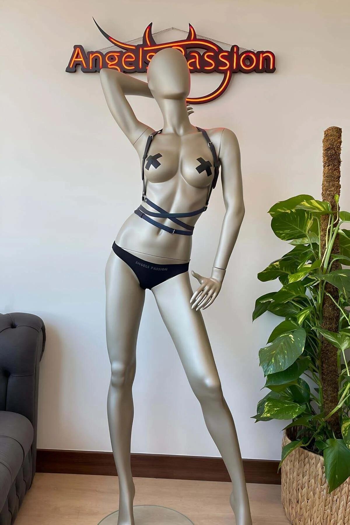 Adjustable festival body harness layered over dark bodysuit showing full strap configuration