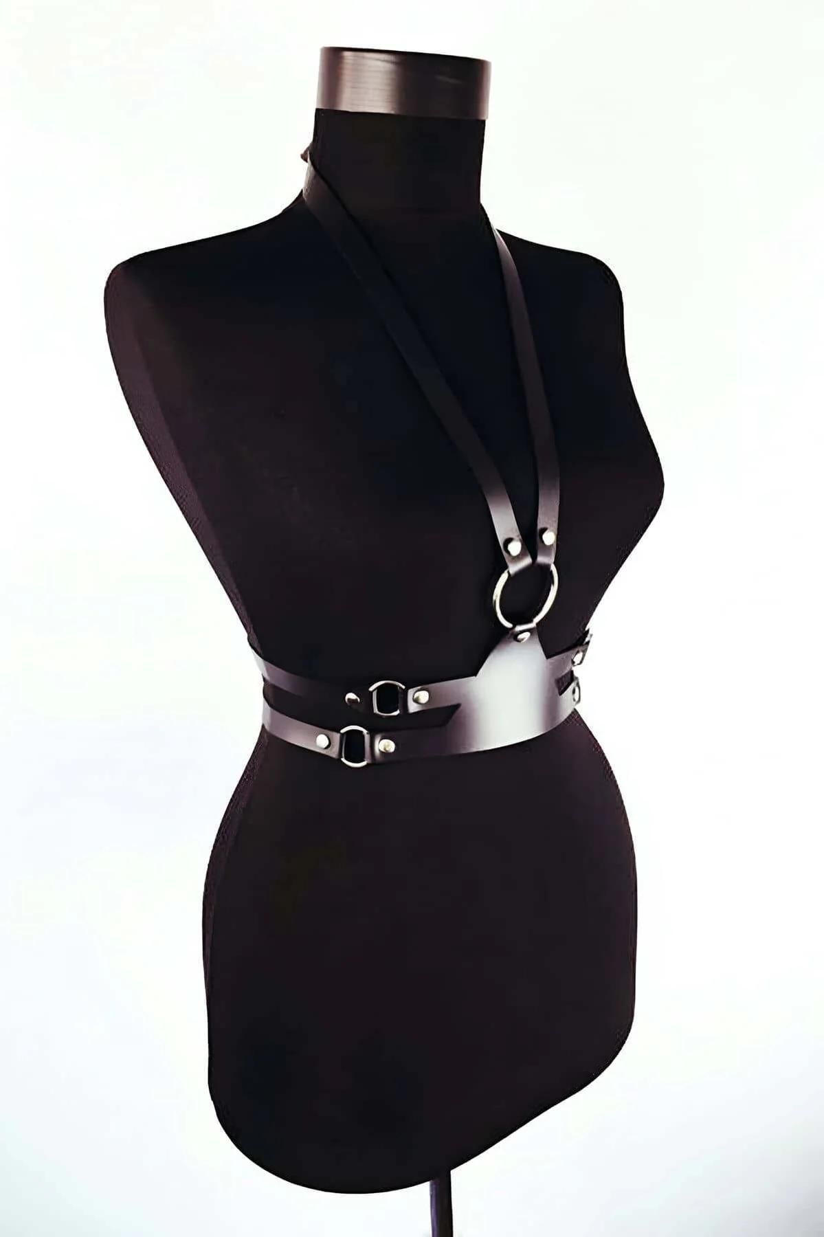 Side buckle and D-ring hardware detail on black PU leather waist belt harness