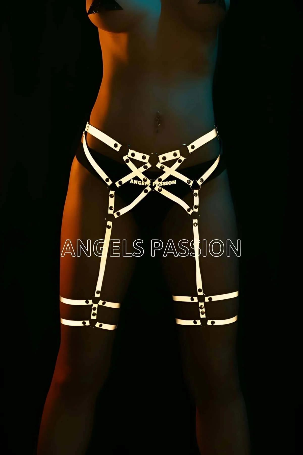 Reflective garter harness thigh bands glowing under UV festival lighting
