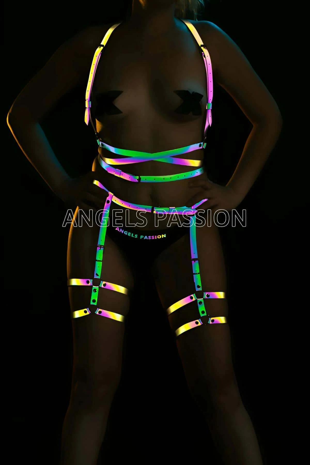 Rainbow reflective full body harness set with chest waist and thigh strap bands glowing pink green yellow under UV festival l