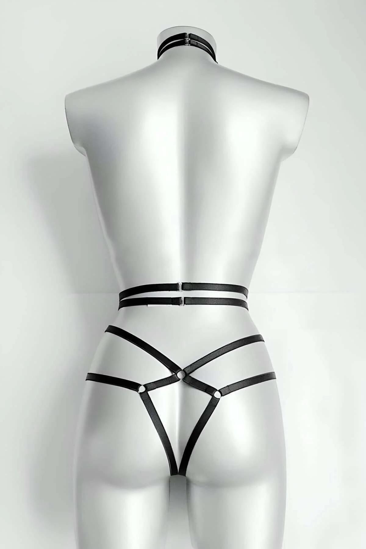 Close-up of black faux leather neck collar with front silver O-ring and 1 cm strap detail