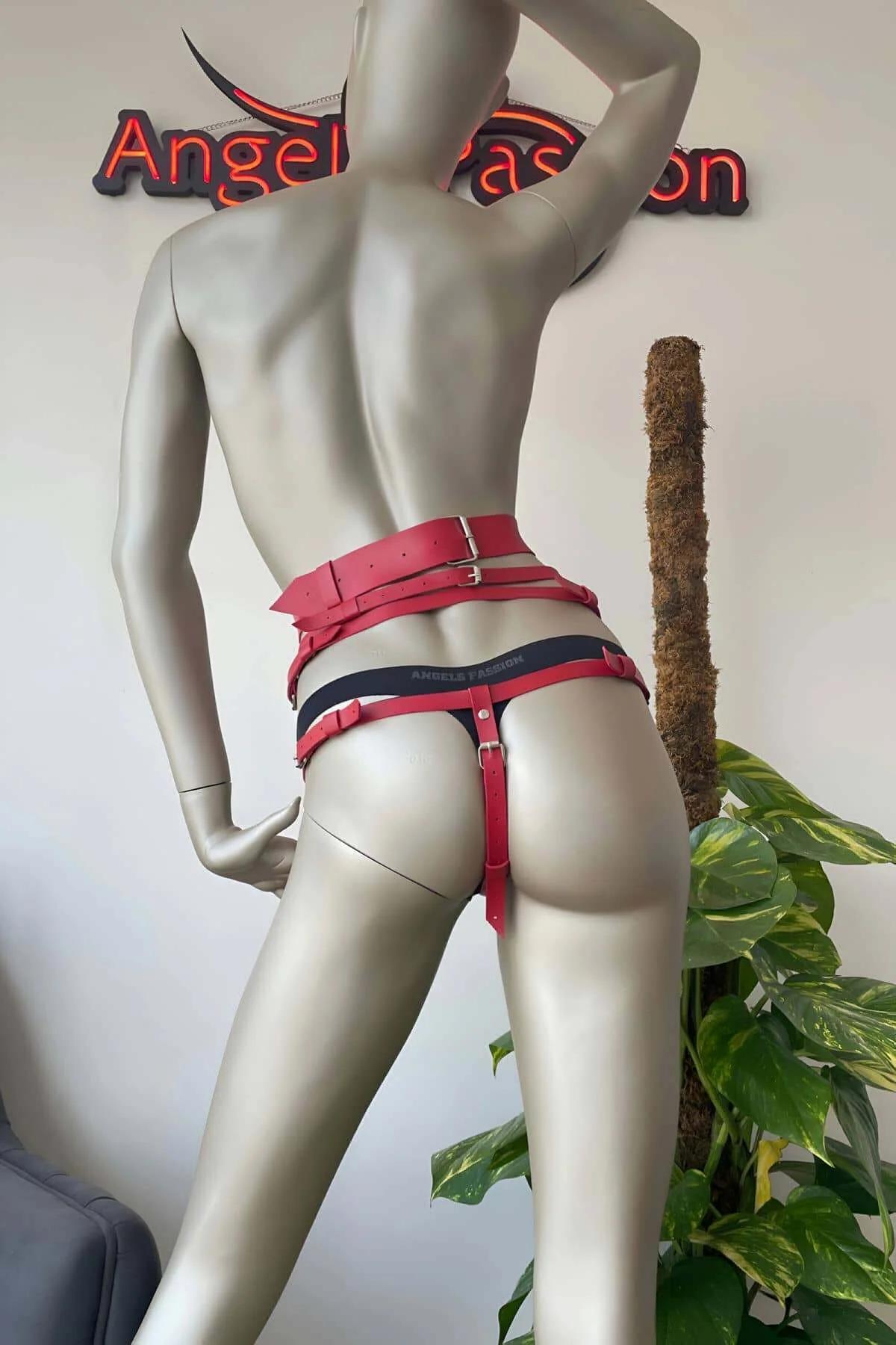 Side view of red waist harness showing garter clip and hanging tassel bundles on thigh