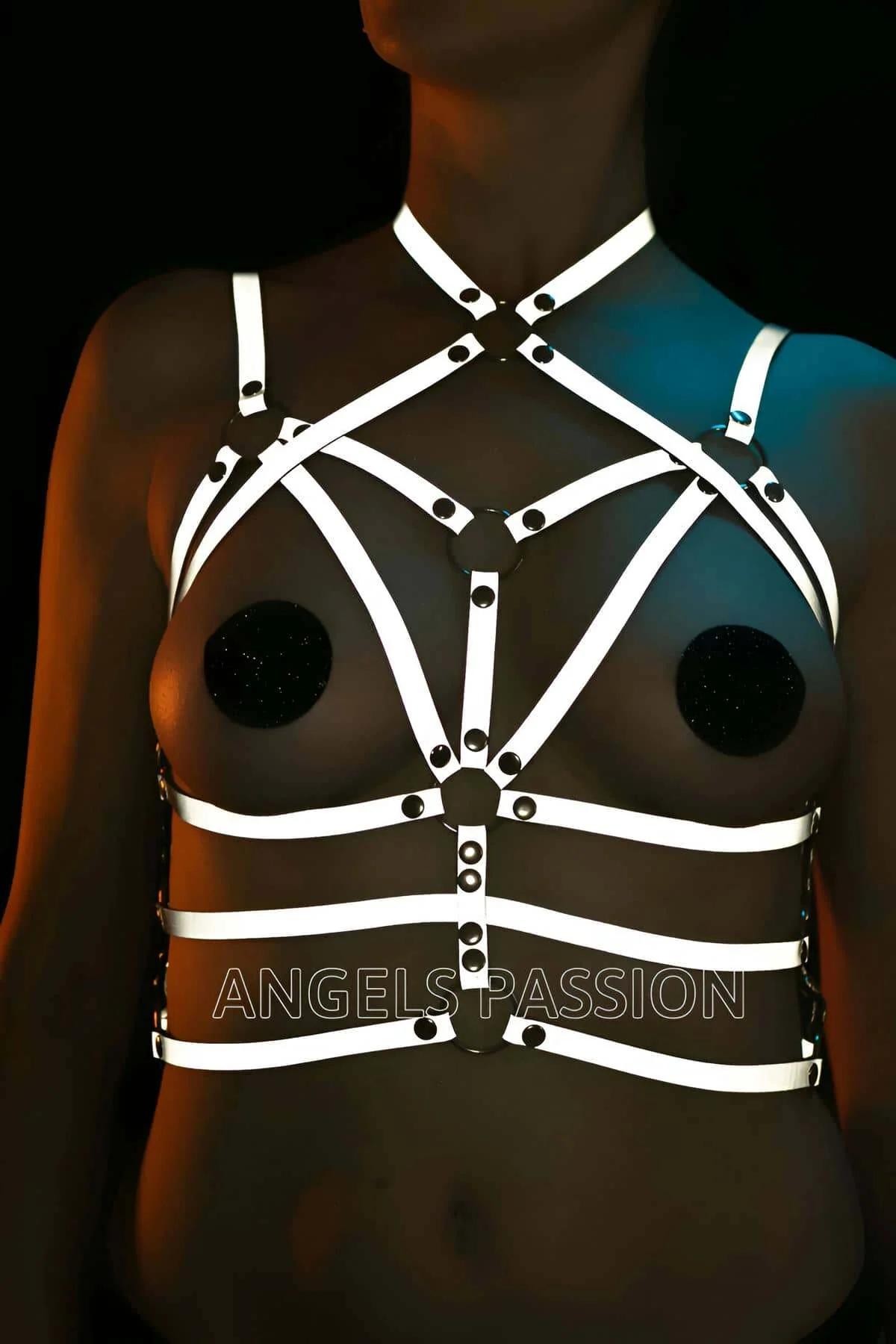 Full torso view of white reflective body harness with wide waist band and multi-panel chest cage