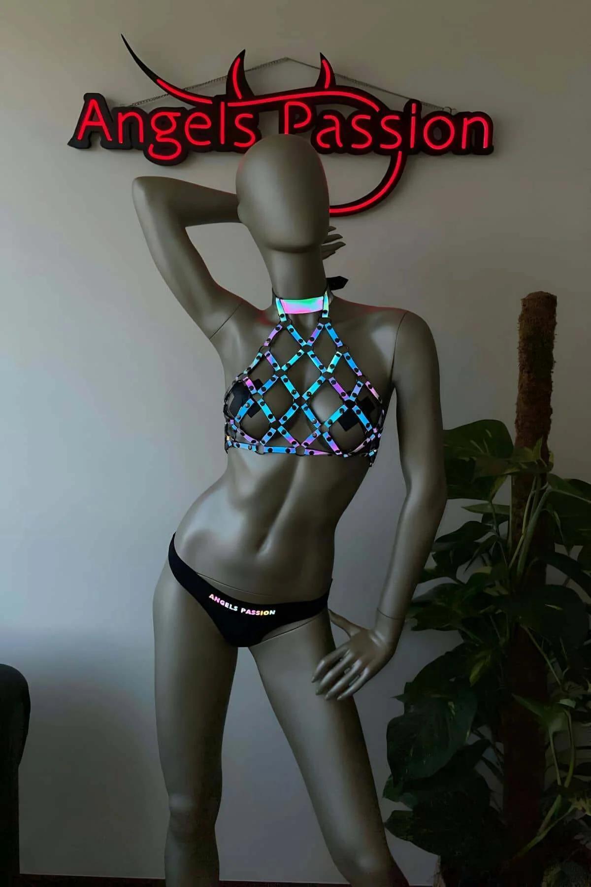 Diagonal diamond lattice grid pattern of reflective harness top with open chest windows under UV lighting