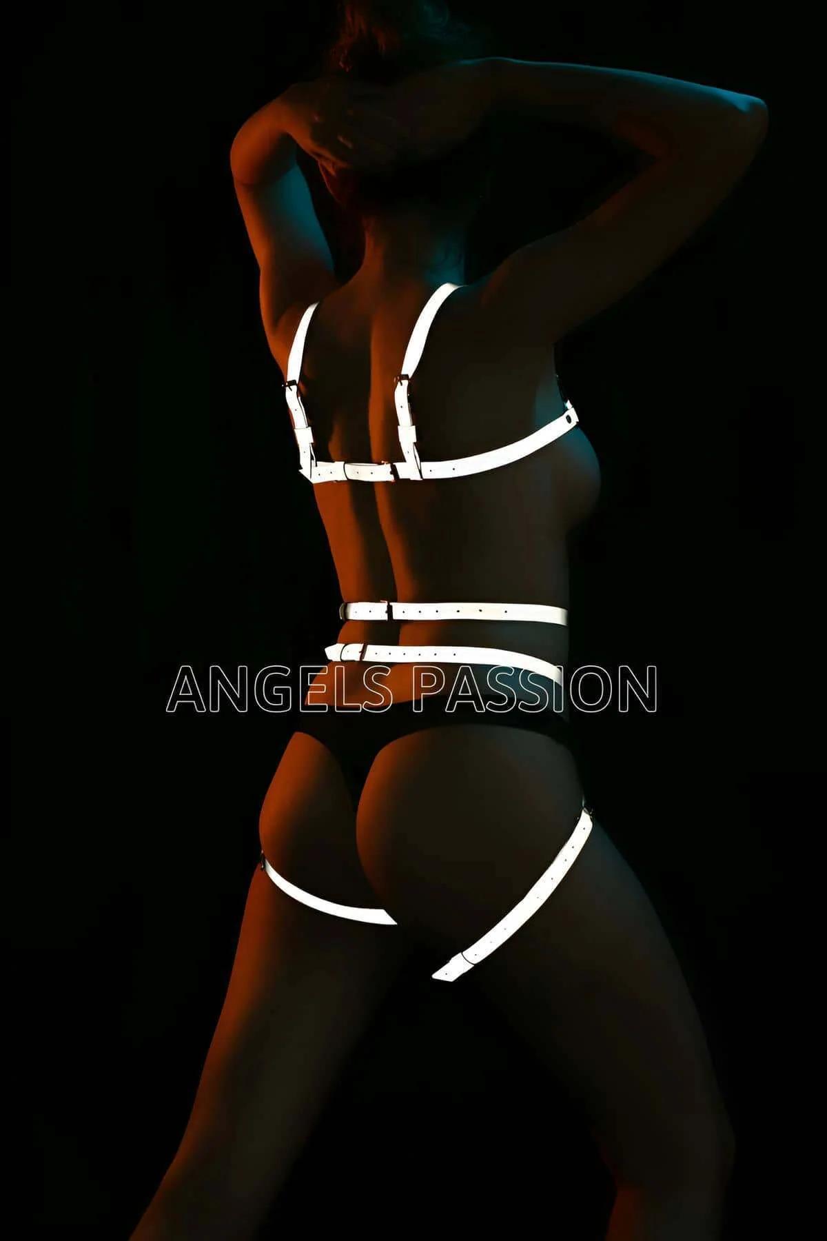 Full body harness reflective straps glowing white showing waist and hip band cage layout