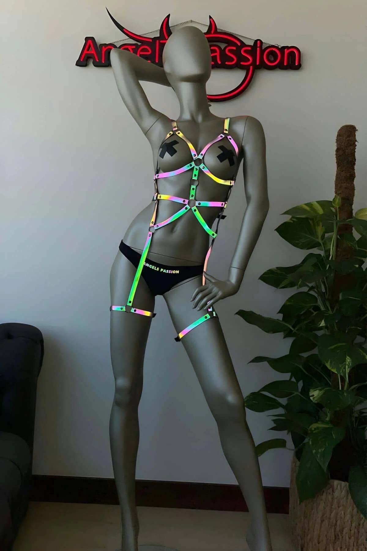 Full body view of iridescent reflective harness with waist band and matching thigh pieces under neon light