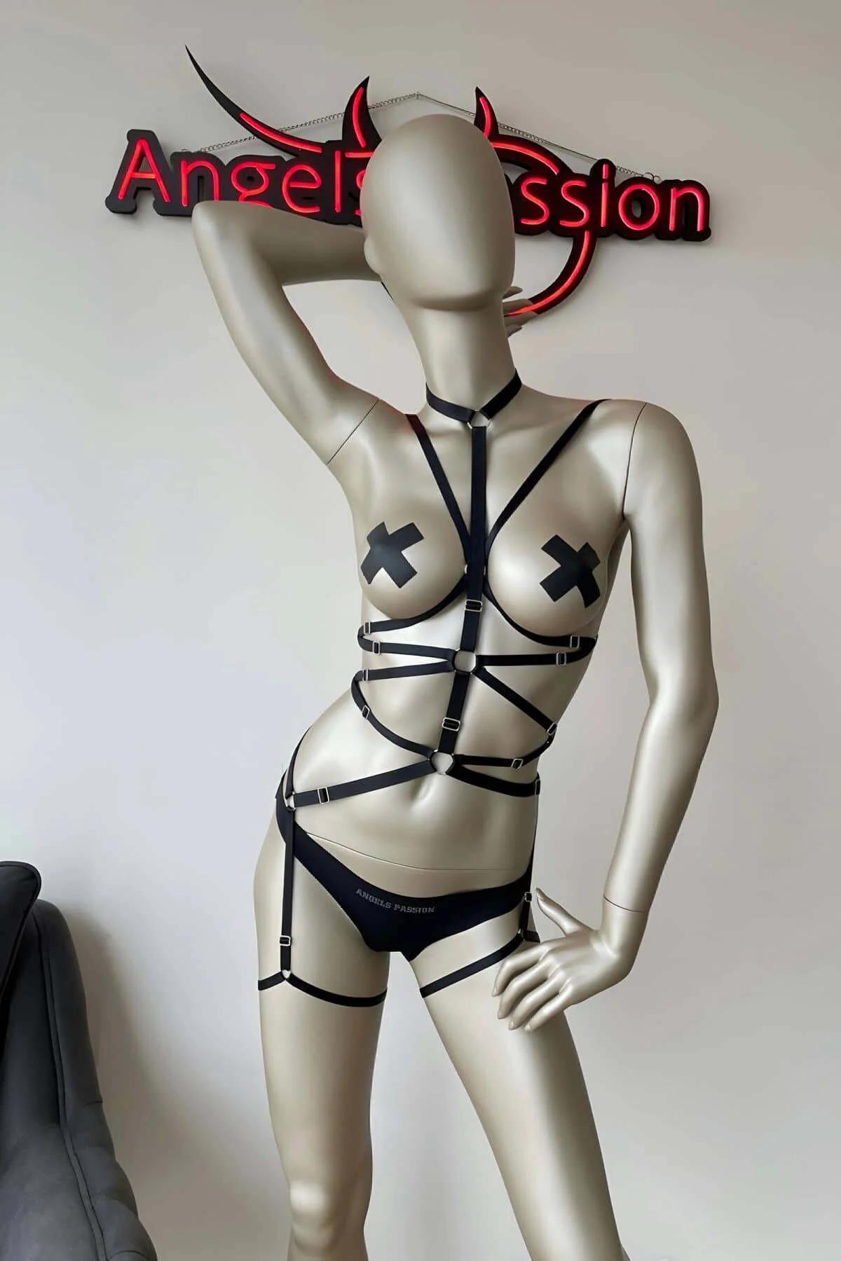 full body black elastic harness with collar band and star-burst torso strap pattern side angle
