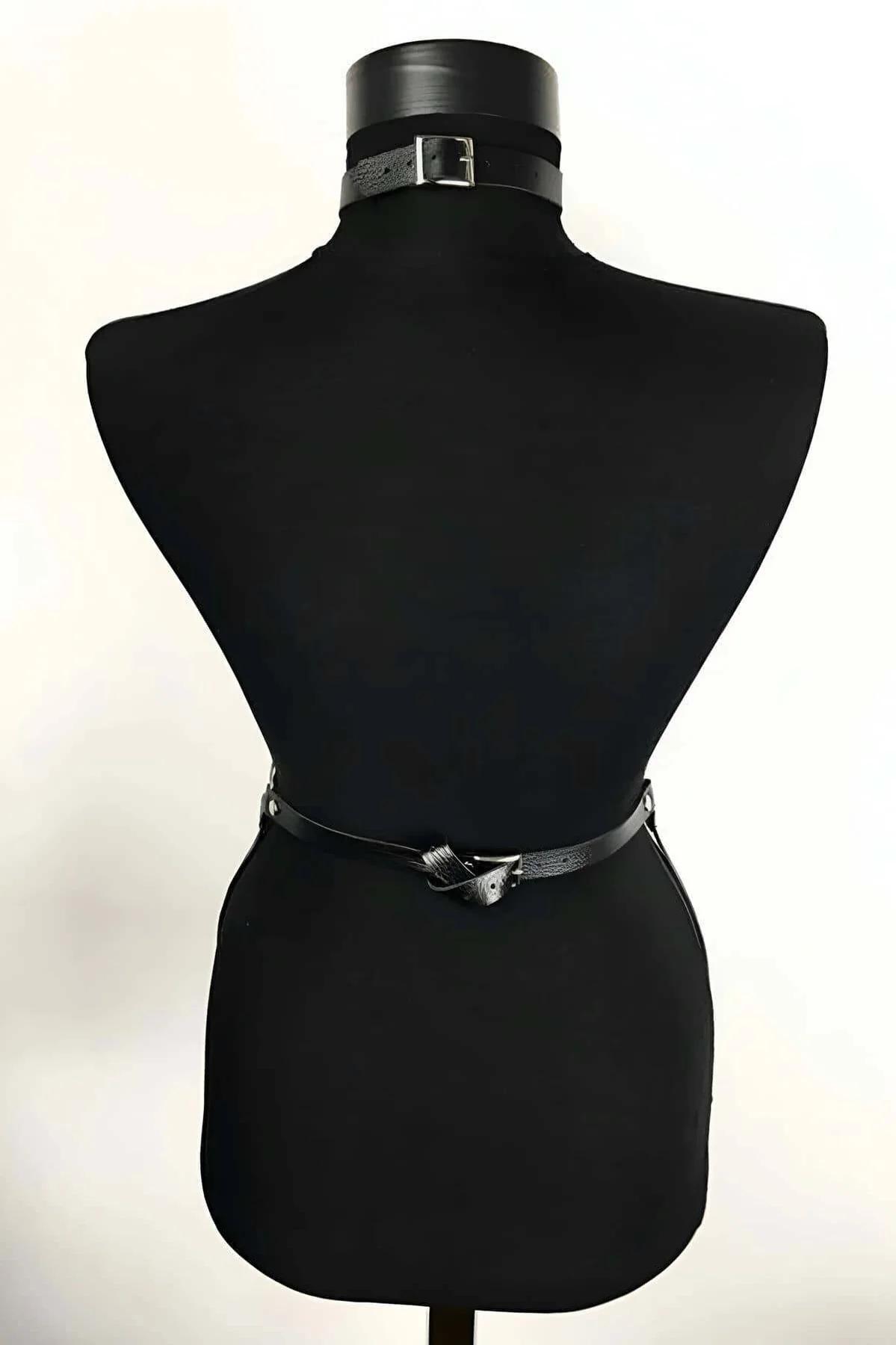 Triple layered silver-tone curb chains attached to black faux leather waist band with lobster-claw closures