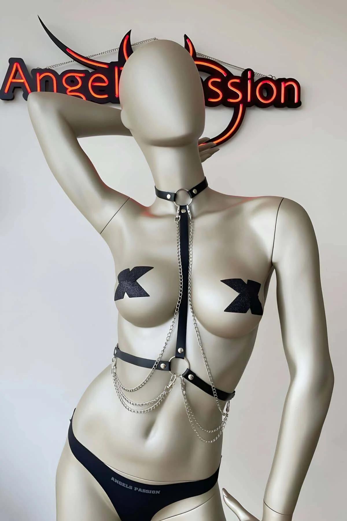 Waist band detail showing double-layer silver chain loops and metal buckle closure