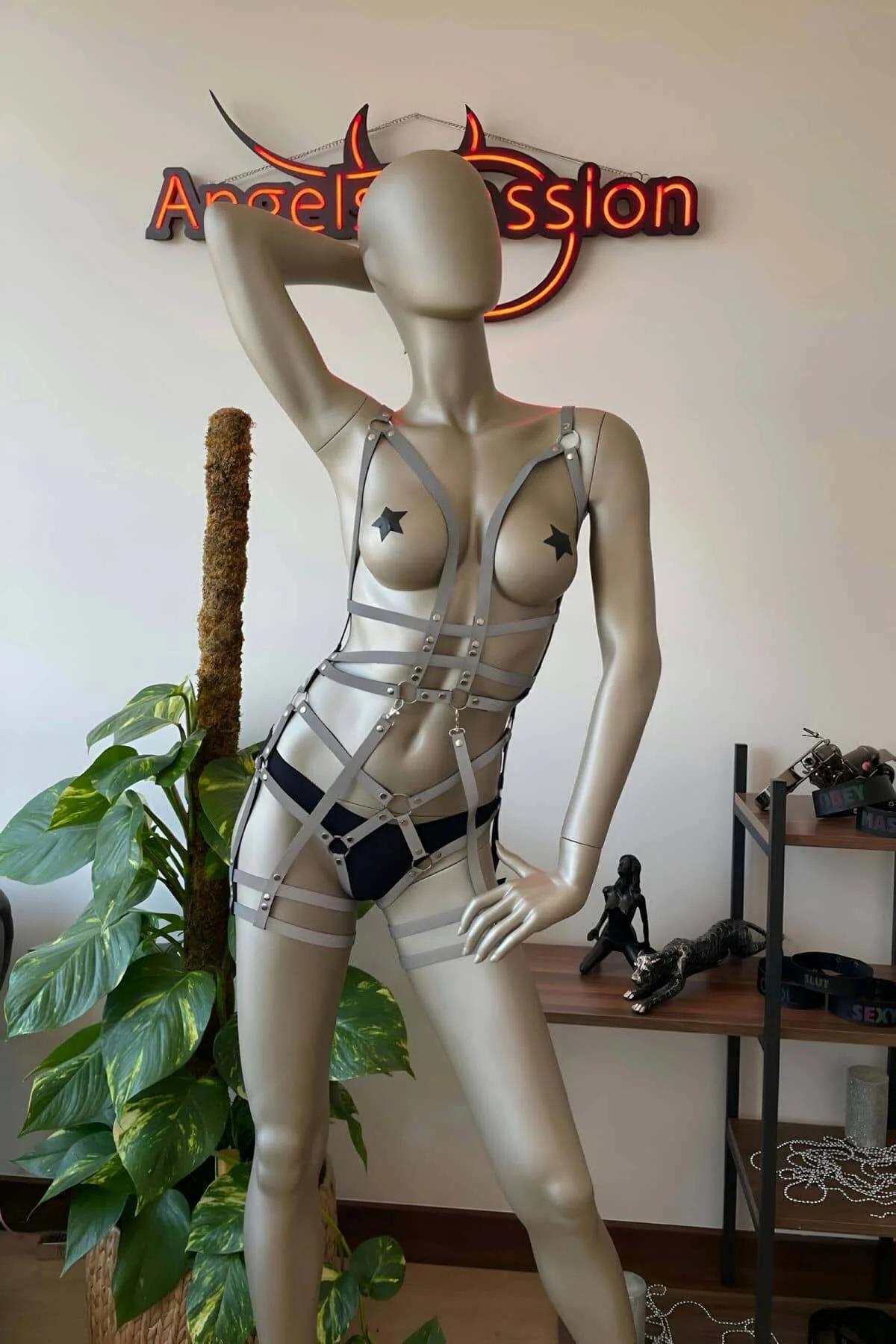 Full-length side view of reflective cage harness showing shoulder-to-thigh strap coverage