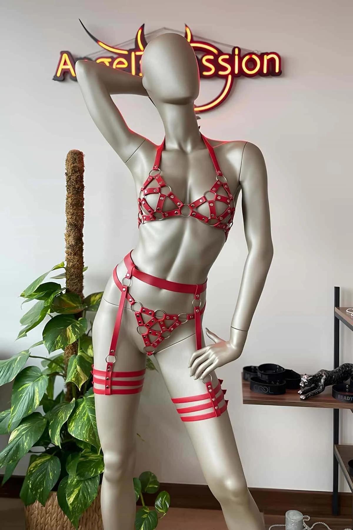 Red PU leather caged bra top with six silver O-rings and adjustable shoulder straps, front detail