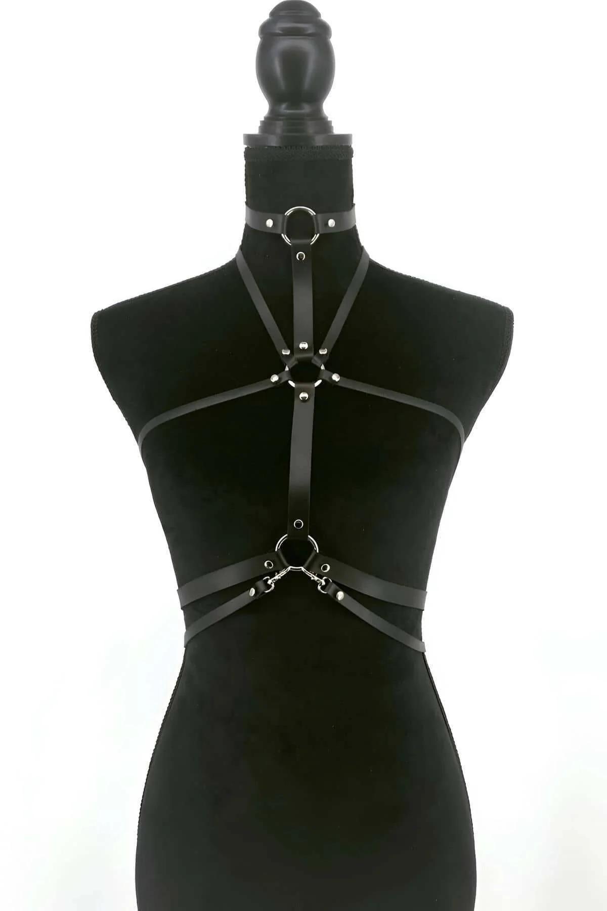 Adjustable black PU leather chest harness showing chrome O-ring at collar and midriff anchor points