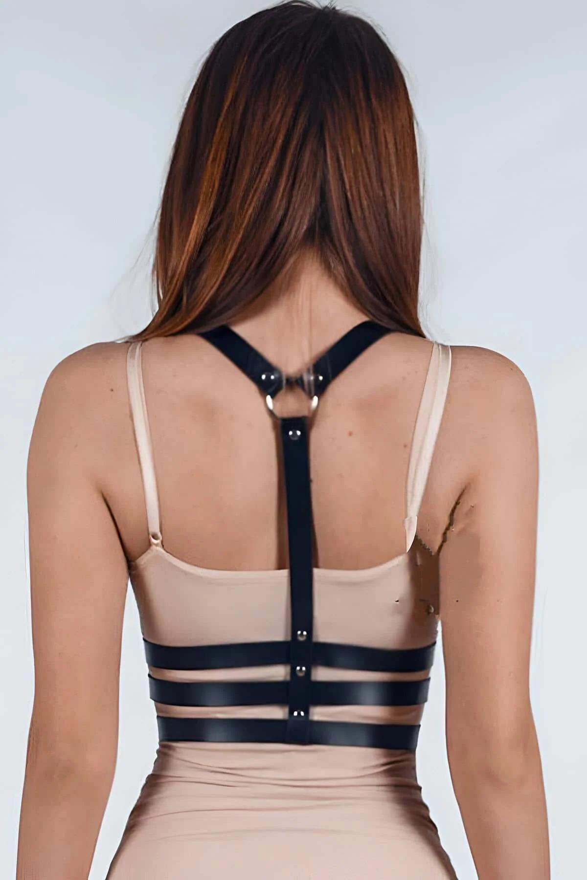 Adjustable black PU strap chest harness showing silver snap studs and vertical center strap detail