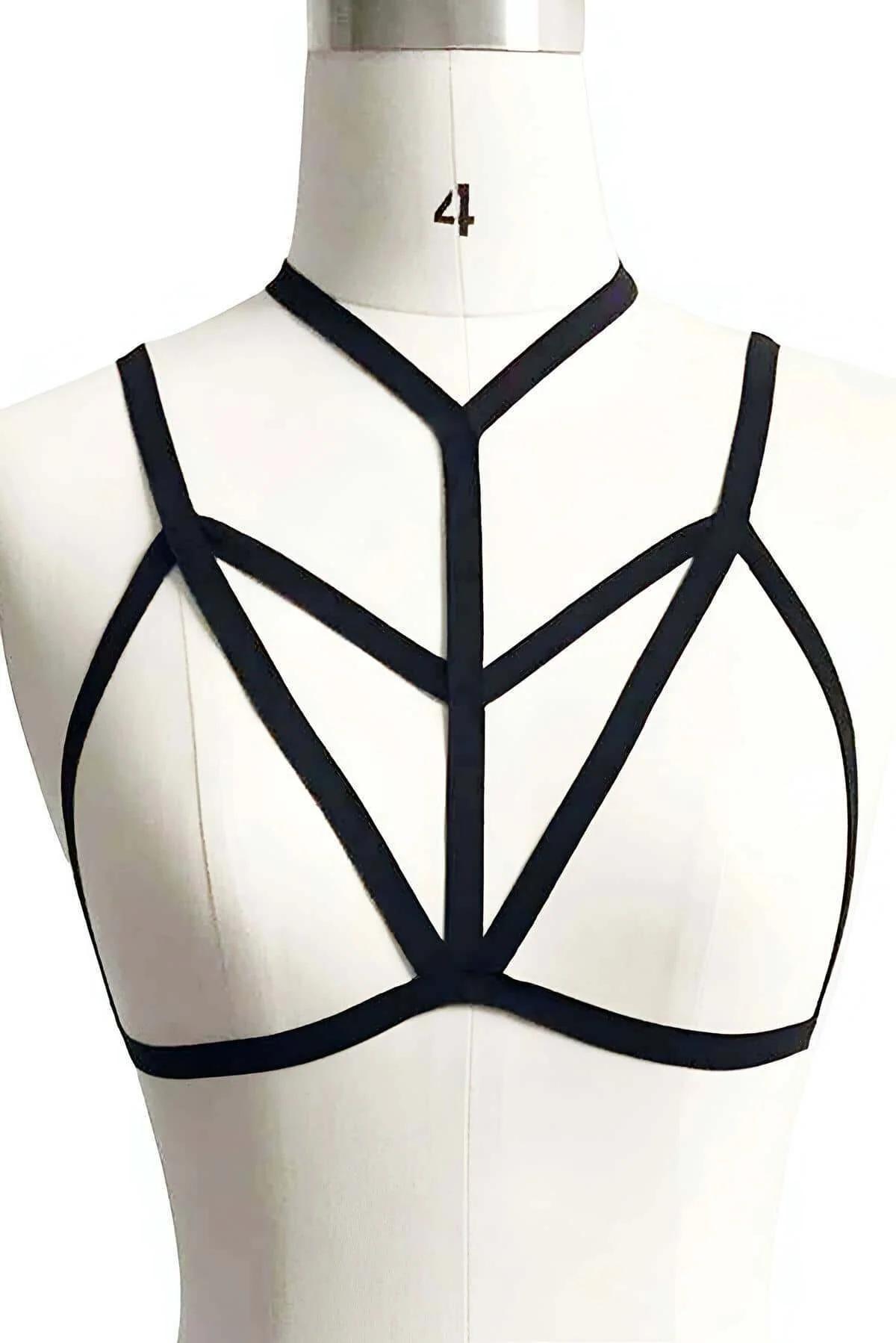 Close-up of black elastic cage harness showing converging strap pattern at sternum detail