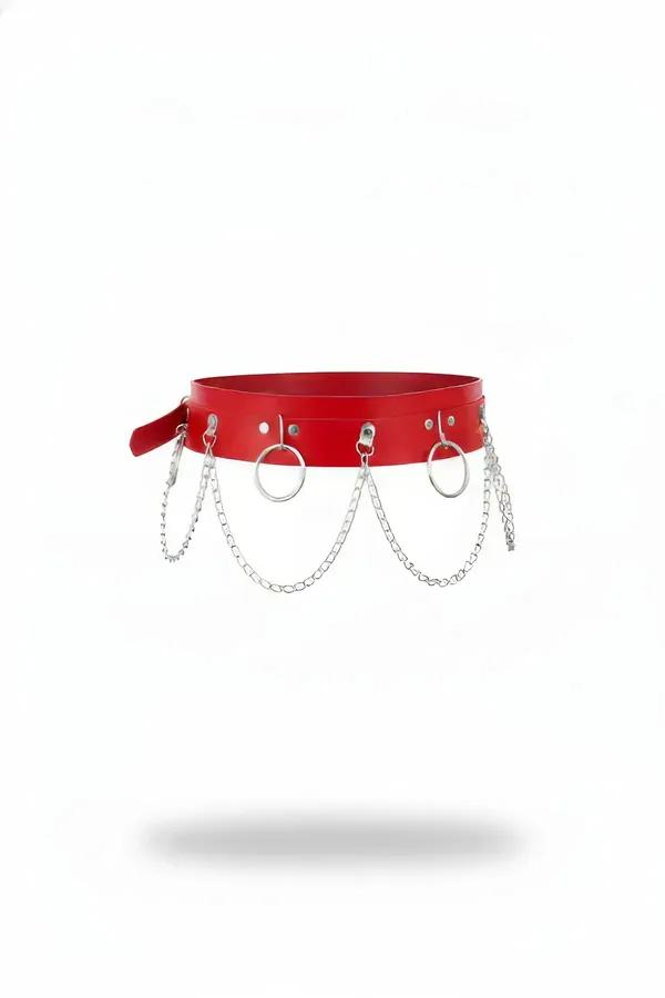 Red faux leather waist harness with three silver O-rings and draping silver link chains on white background
