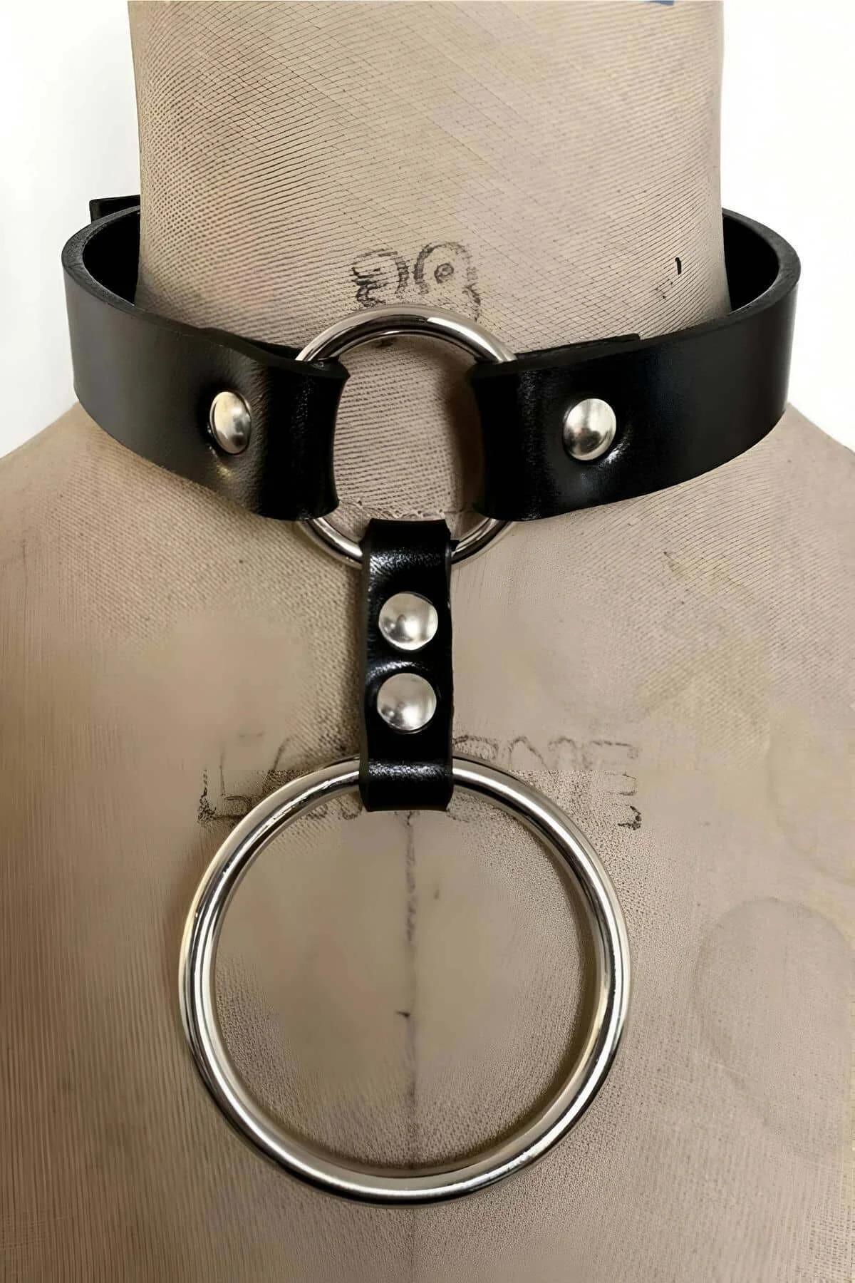 Close-up of double silver O-rings on black PU leather choker band with rivet detail