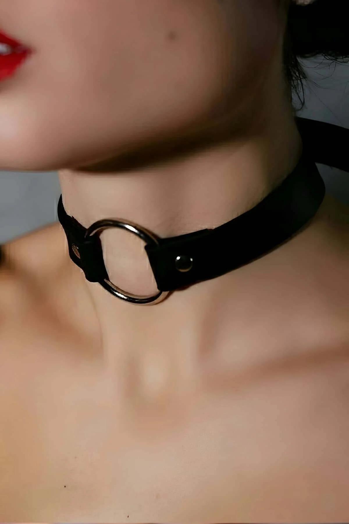 Wide matte black faux leather choker band with single polished silver O-ring front view