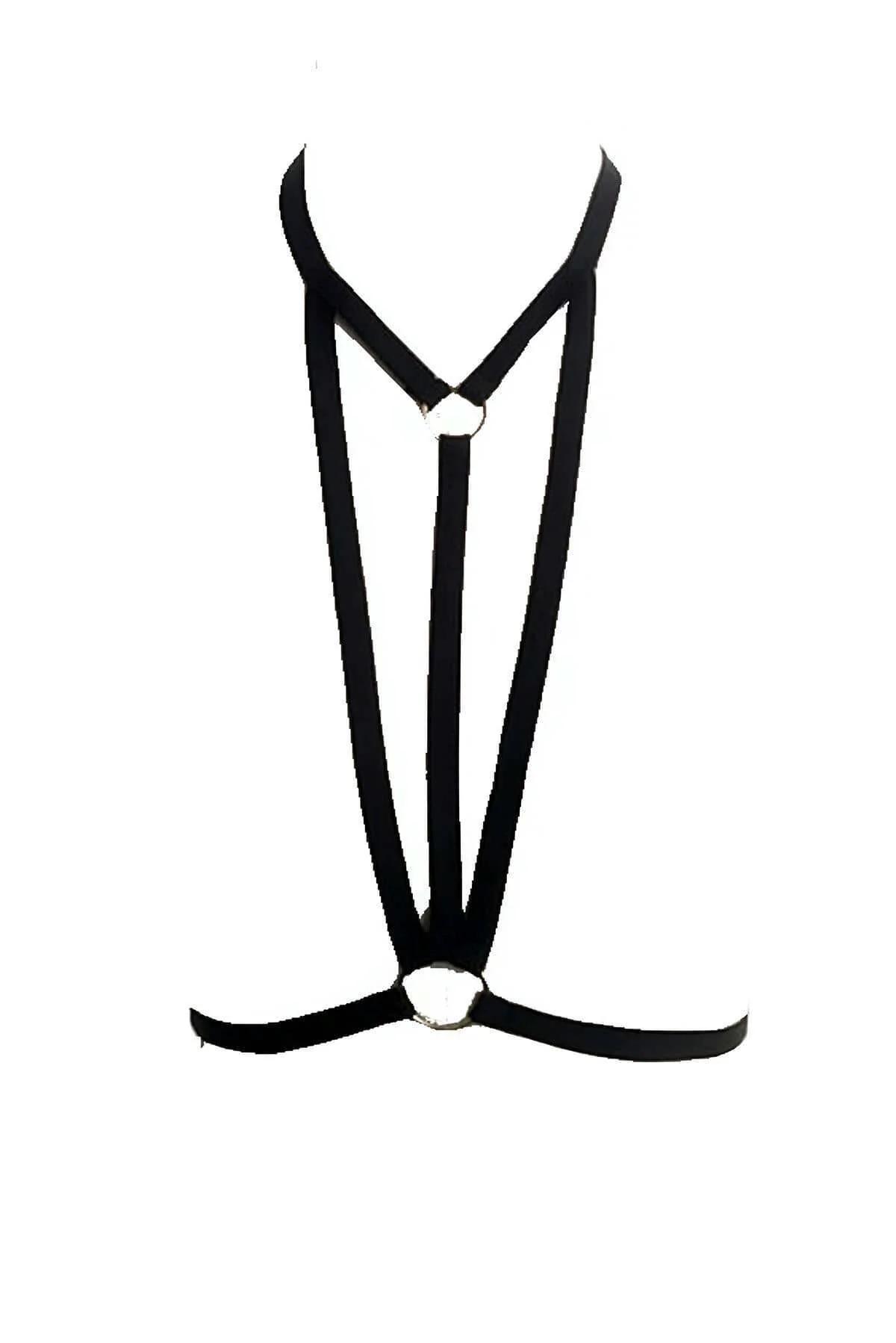 close-up of silver O-ring at sternum junction on black elastic chest harness