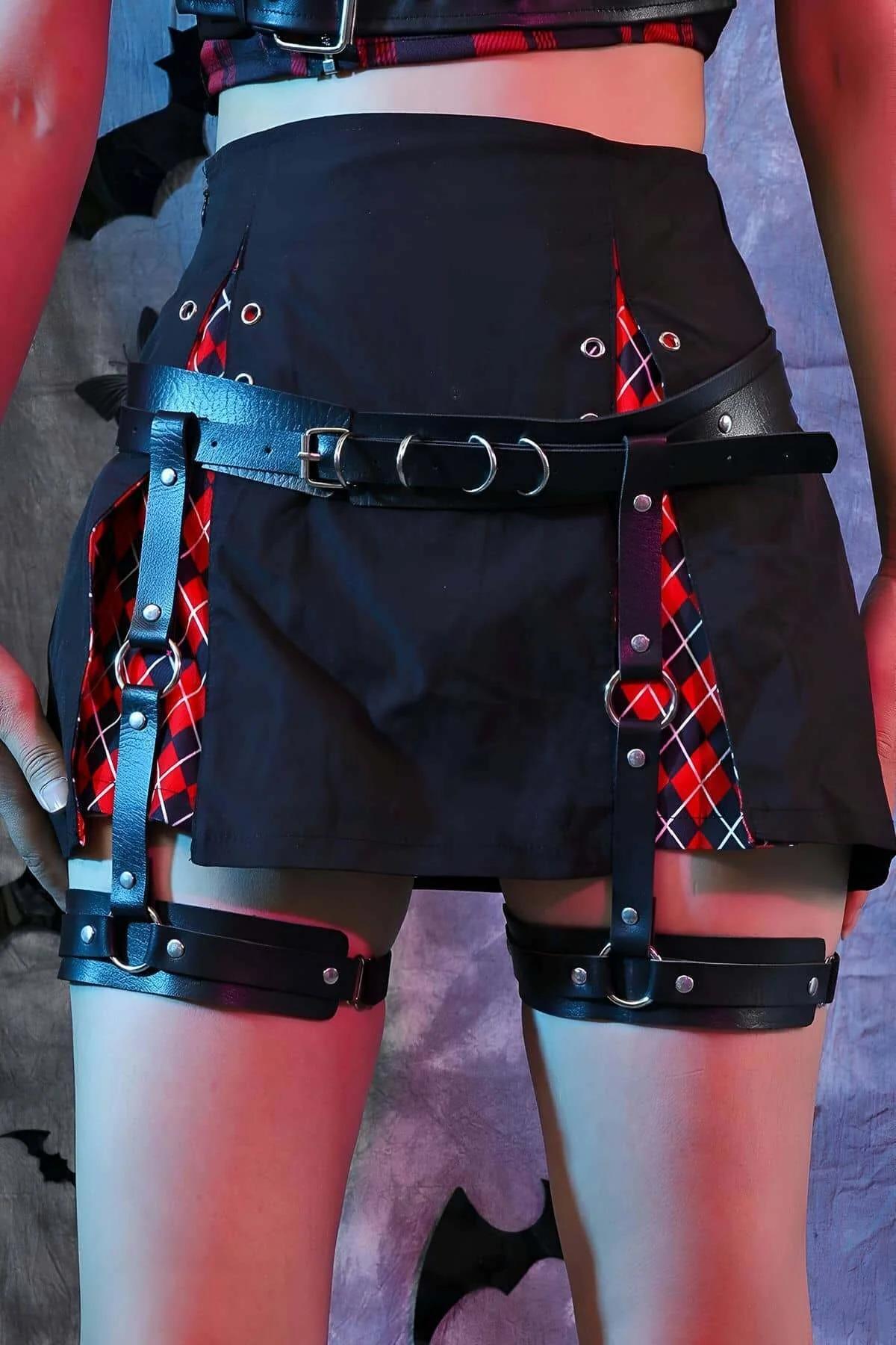 Black faux leather vertical strap garter harness showing thigh band adjustment detail