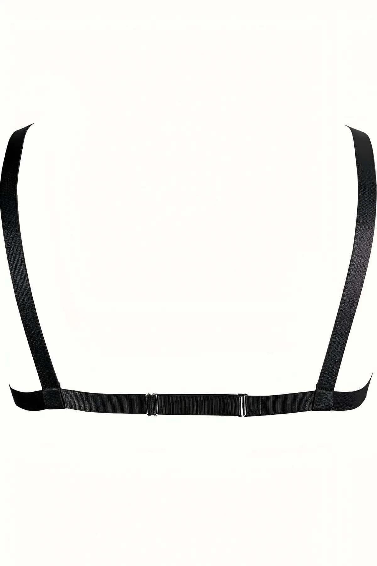 Close-up of silver-tone O-ring and curb chain attachment detail on black elastic harness straps