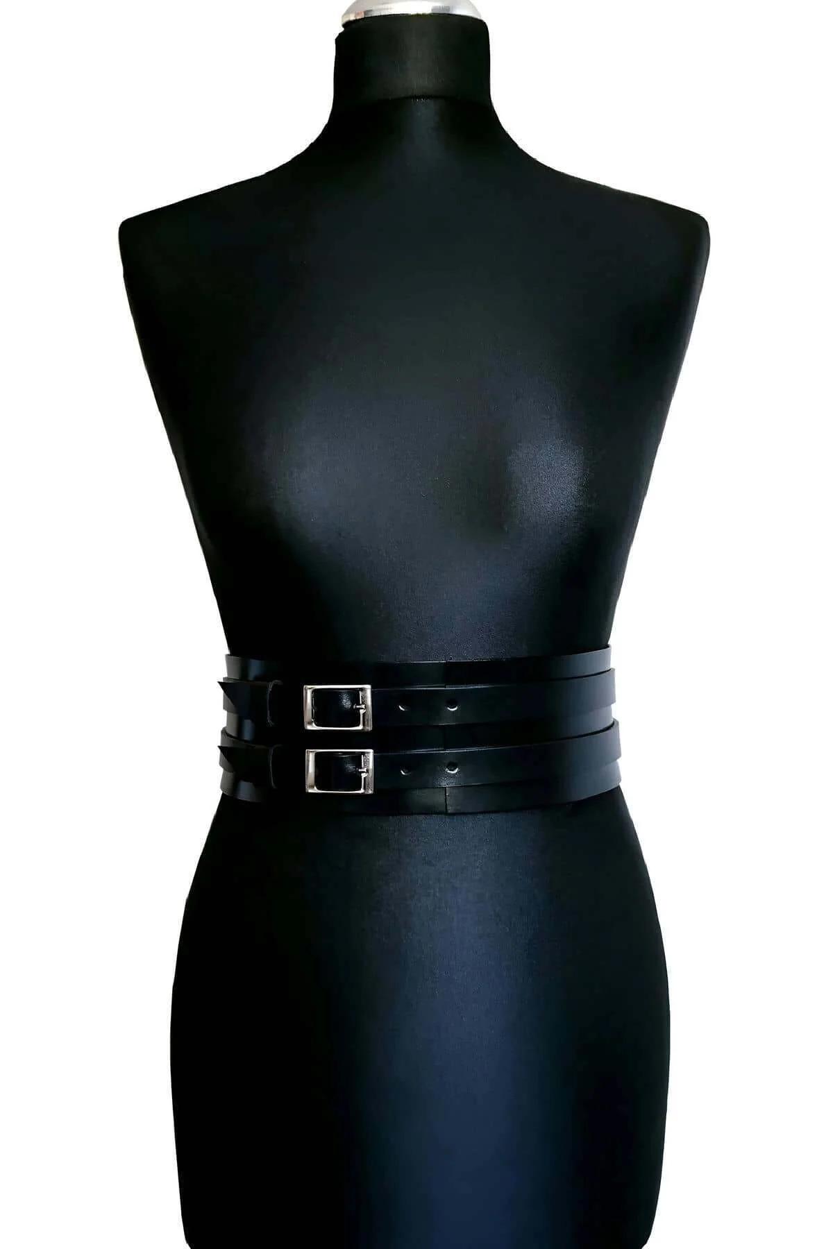 Double buckle black faux leather cincher belt close-up of silver hardware detail