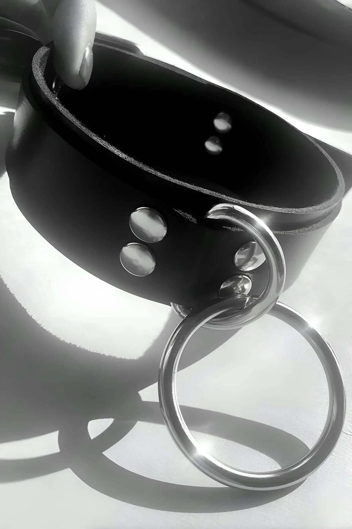black glossy faux leather choker buckle closure detail at back of neck