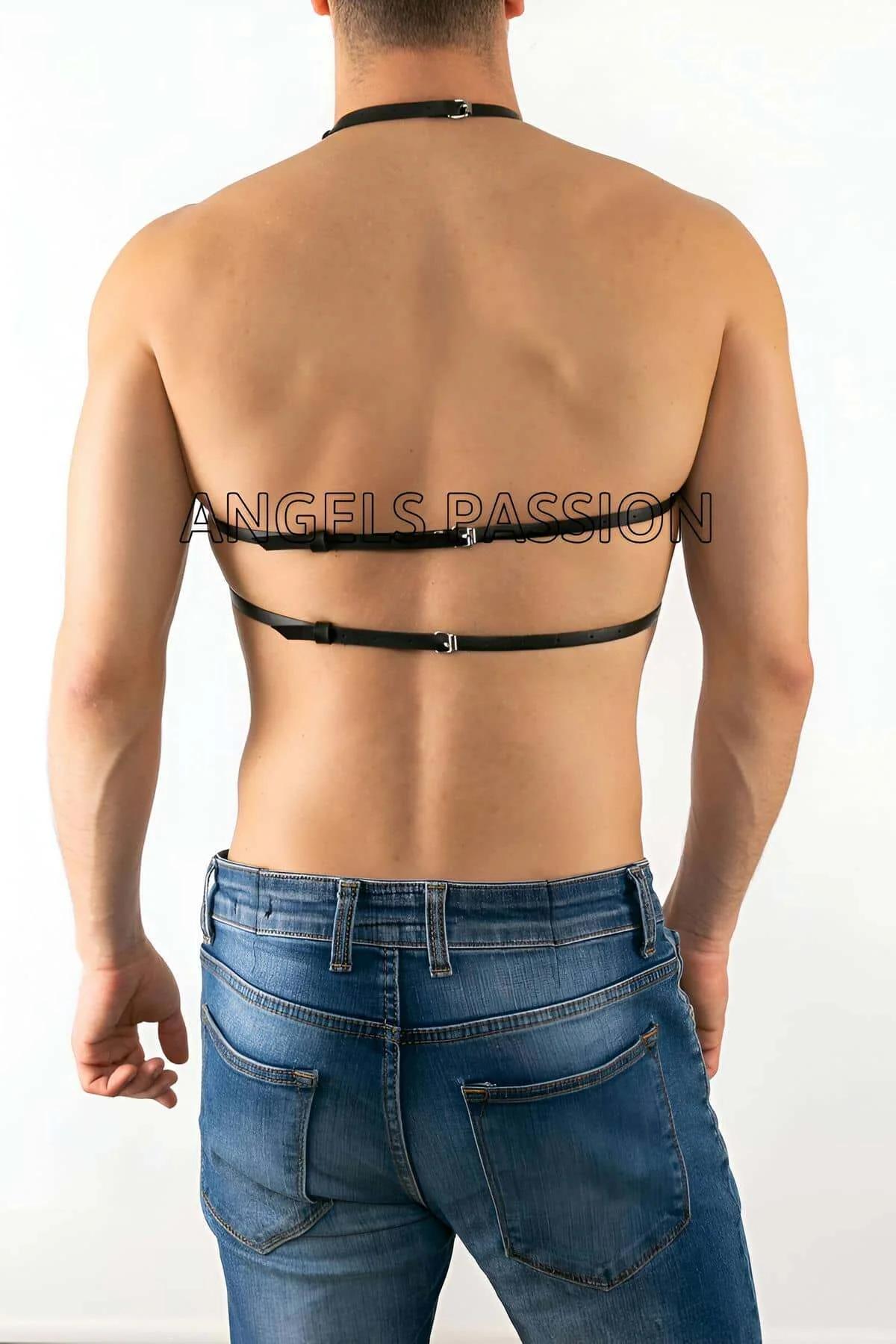 close-up of silver O-ring junction and matte black PU leather straps on geometric chest harness