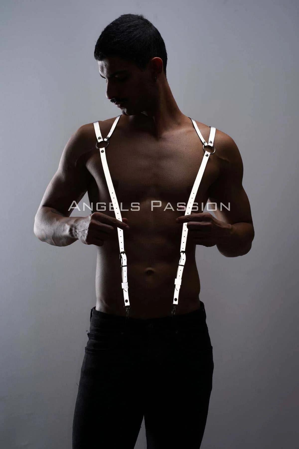 close-up of silver O-ring and prong buckle on white faux leather shoulder harness strap