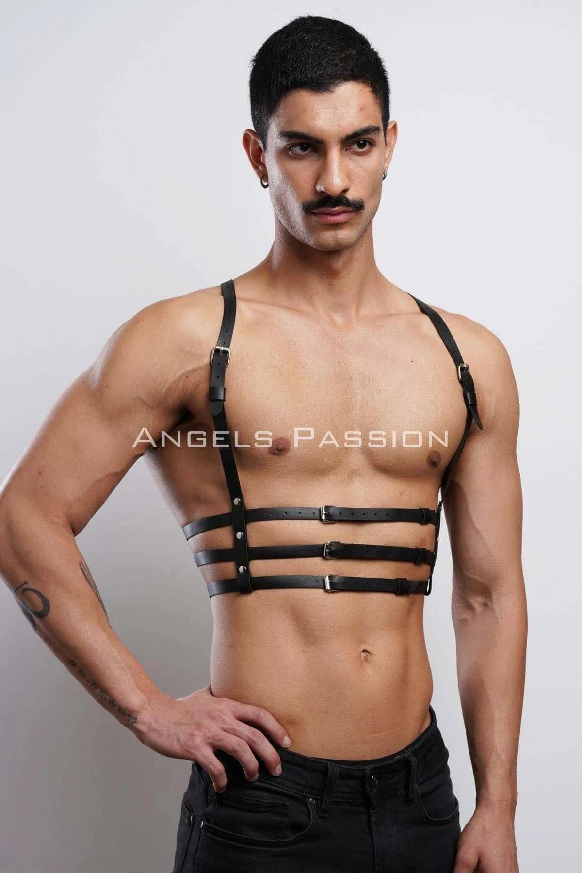 Close-up of three adjustable rectangular silver buckles on black faux leather chest harness straps