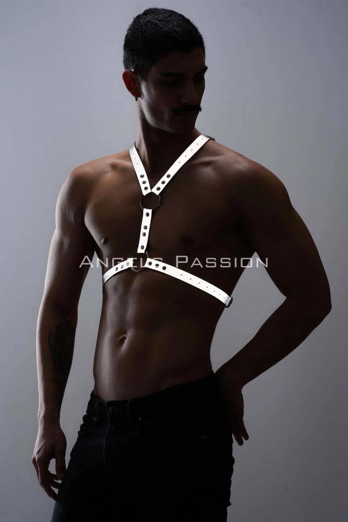 Close-up of dual stacked silver O-rings at sternum center of white reflective chest harness