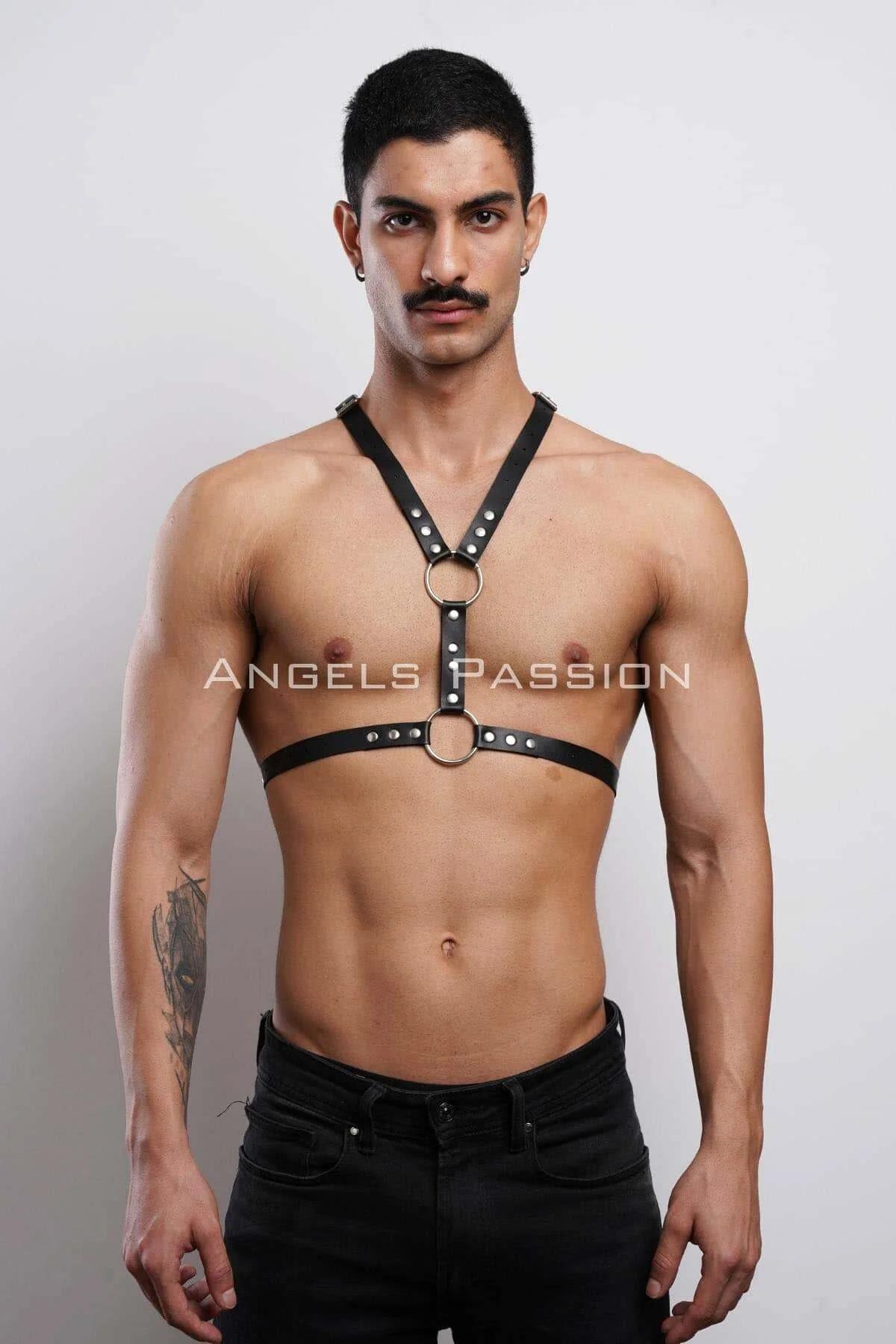 black faux leather body harness with dual silver O-rings and rivet studs worn on male torso
