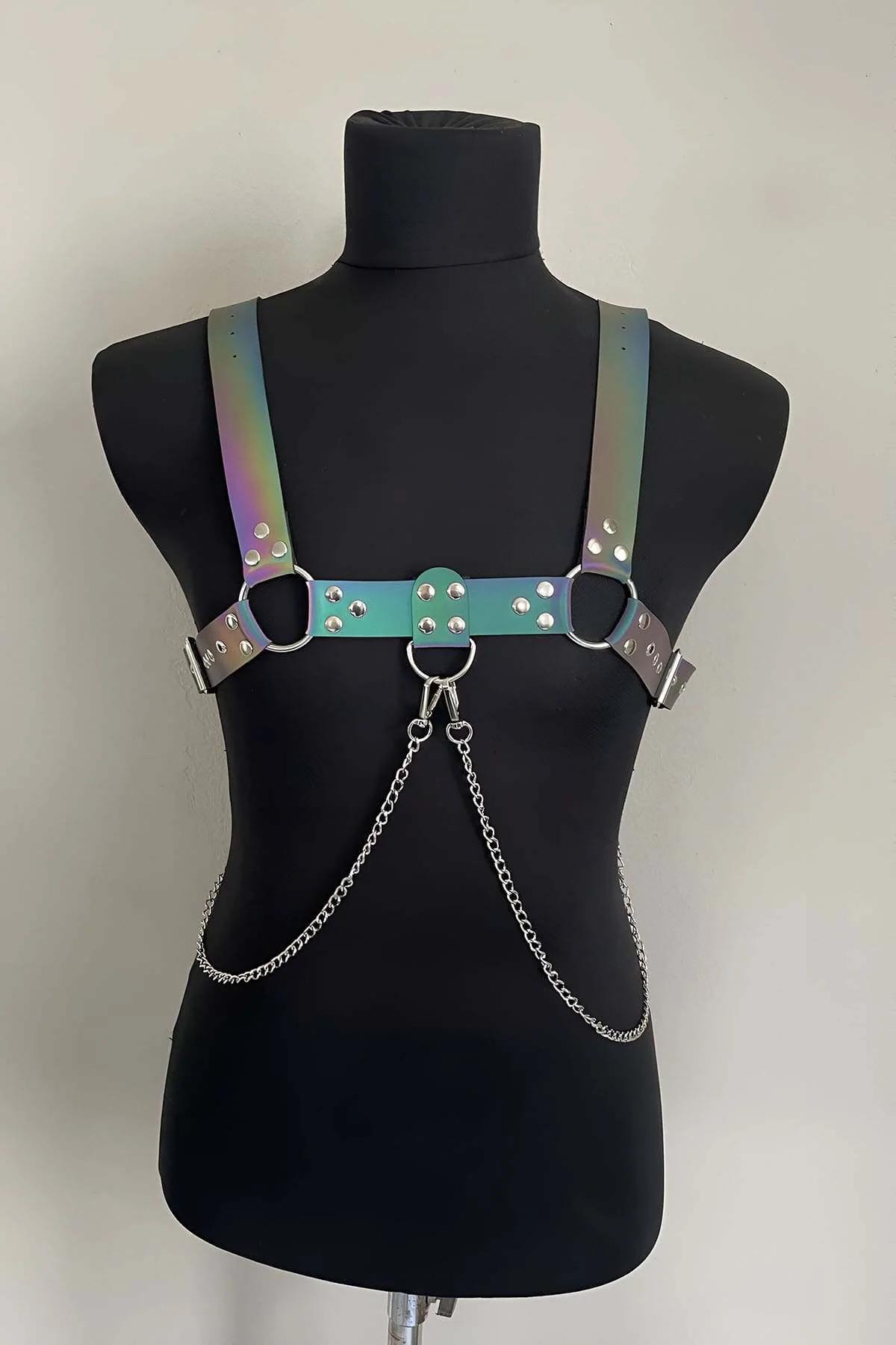 Close-up of holographic rainbow PU strap showing color shift between pink yellow green and blue with silver rivets