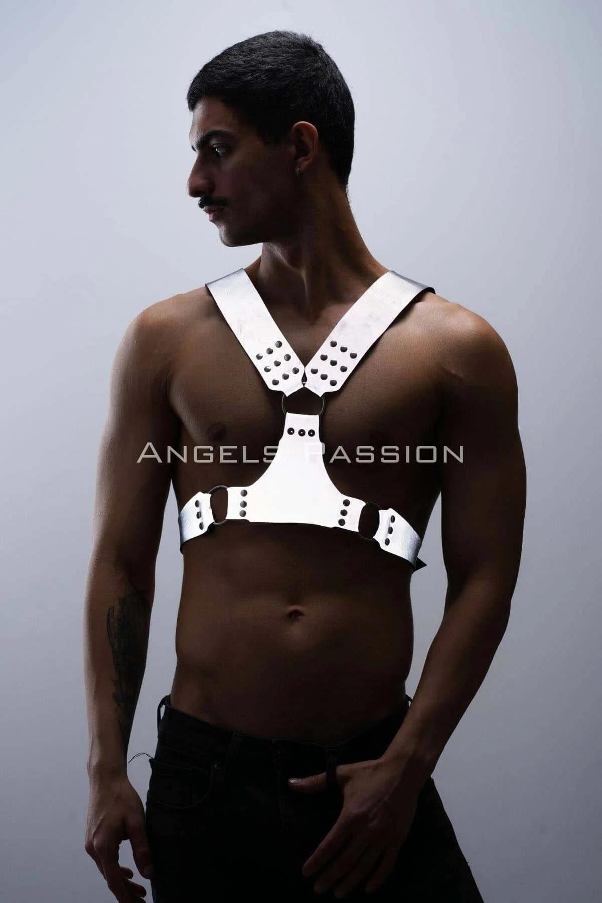 Close-up of white reflective PU faux leather strap panel with dark gunmetal rivet stud cluster at chest junction