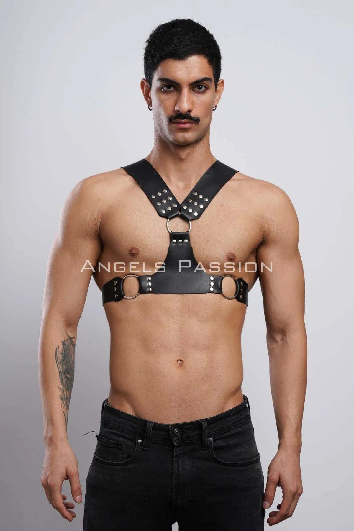 black faux leather chest harness with silver dome studs and three O-rings on male torso