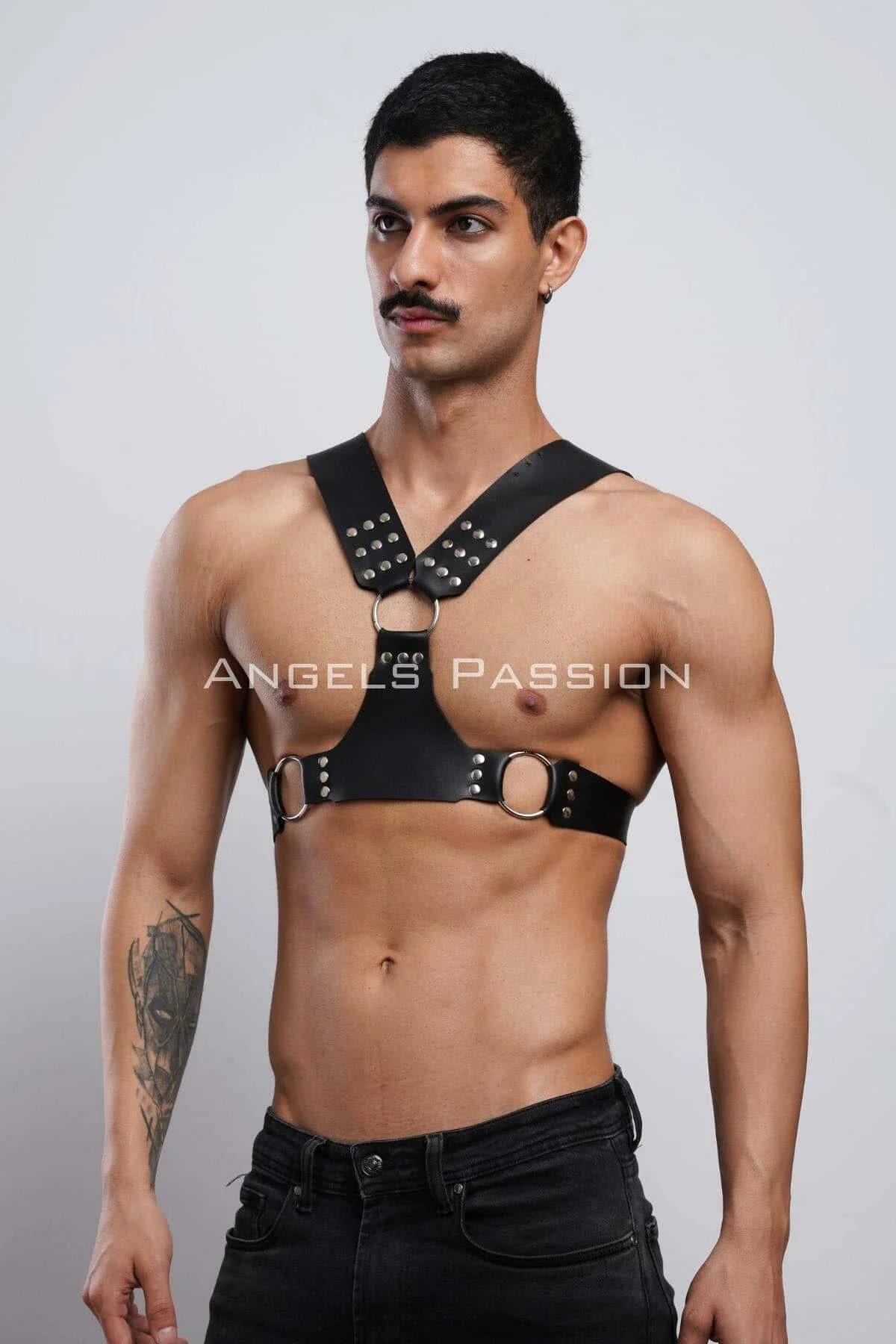 side angle of black faux leather harness showing V-shape shoulder straps and waist band O-rings