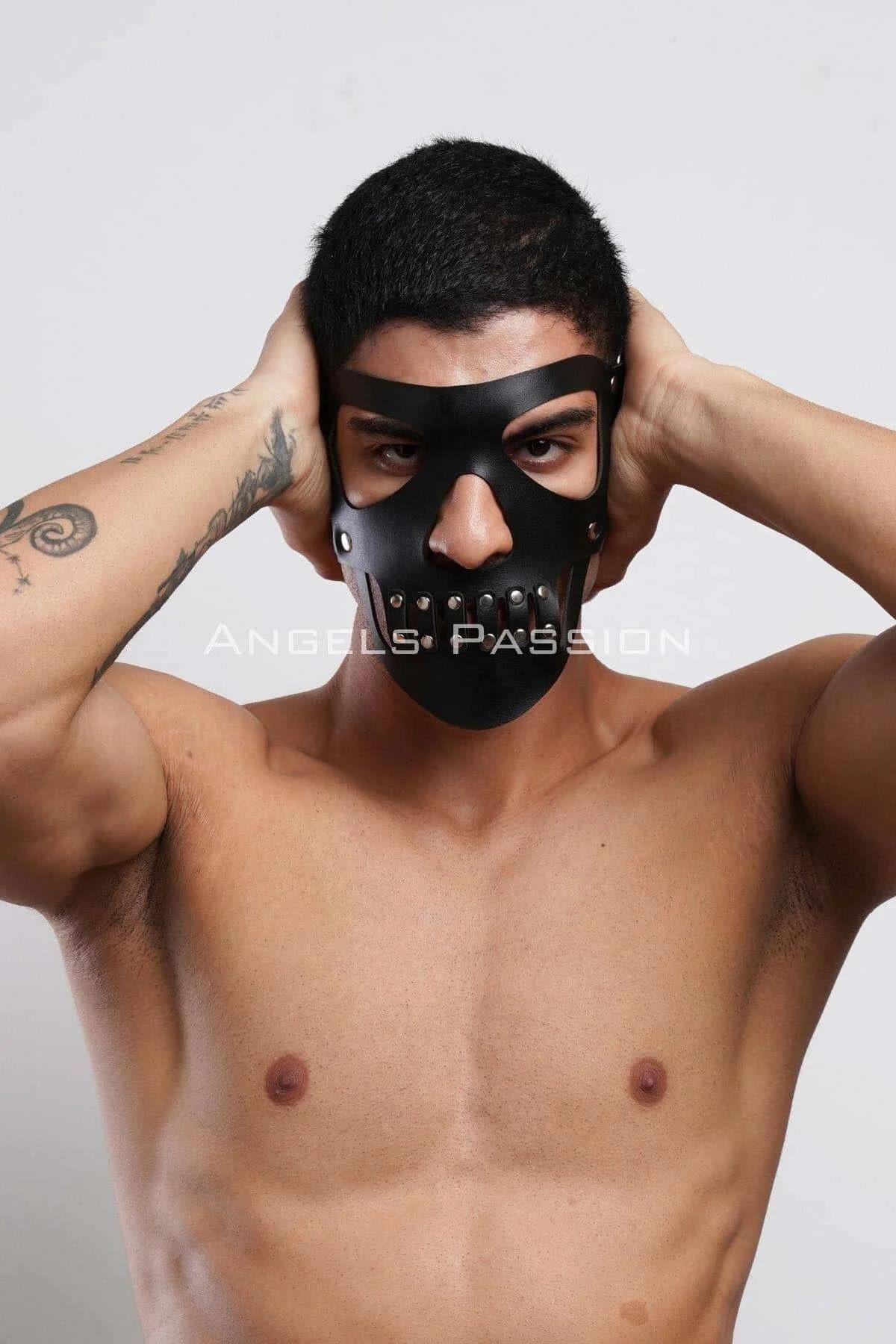 Front view of black PU skull mask with wide eye-socket cutouts and central nose-bridge connecting strip