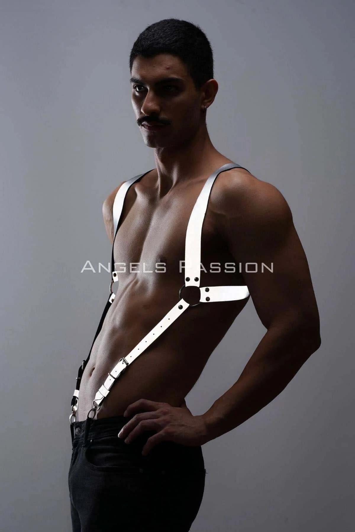 Close-up of silver jaw clips on white reflective suspender strap waistband attachment