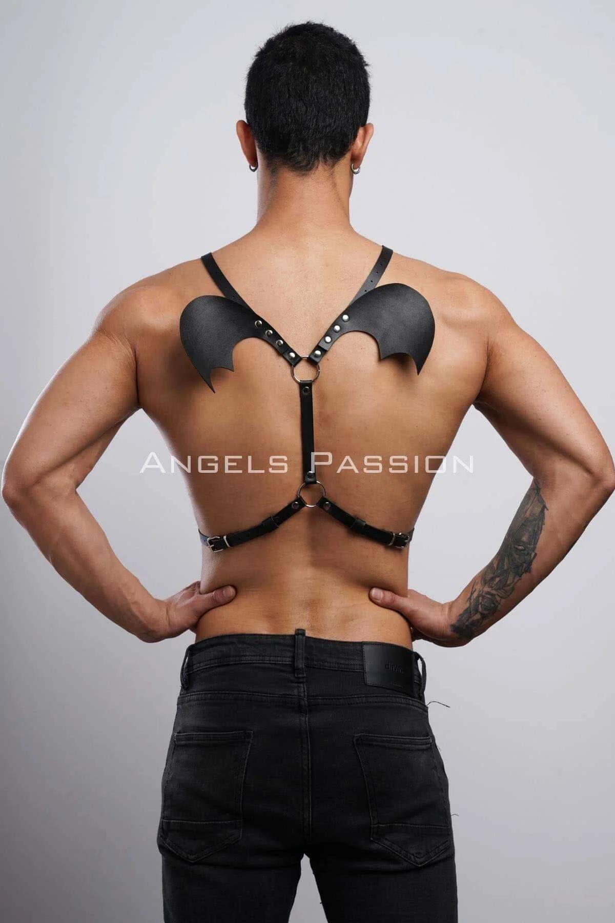 Full back view black bat wing harness worn with dark jeans showing wing-to-waist strap line