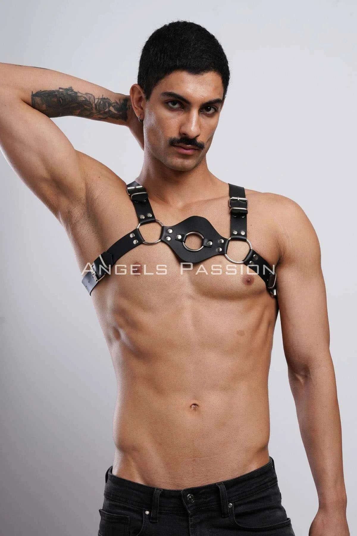 Close-up of silver-tone central O-ring and flanking side rings on black vegan leather chest band